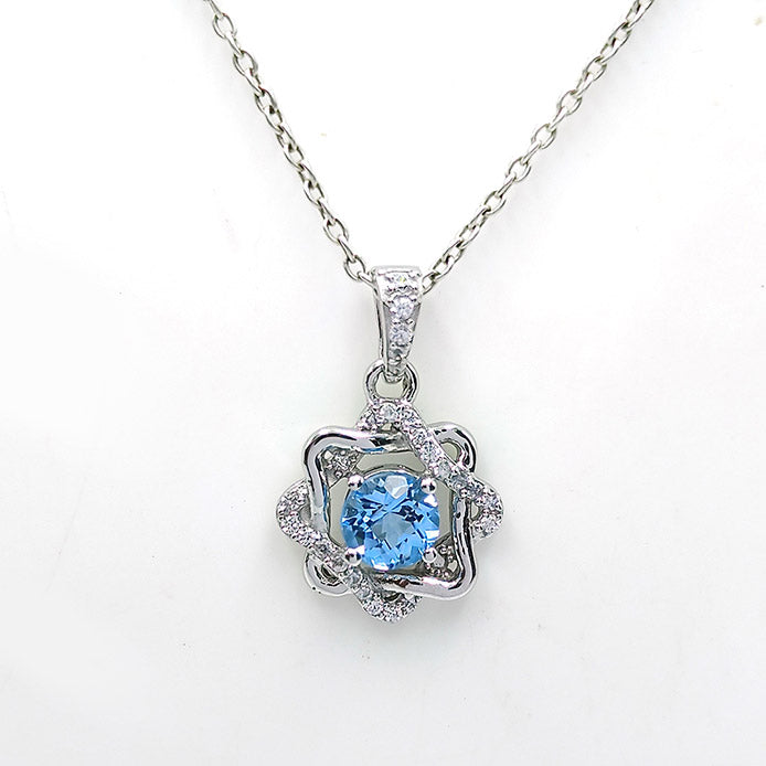 Blue Topaz Rosette Halo Earrings
