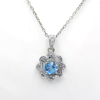 Blue Topaz Rosette Halo Earrings