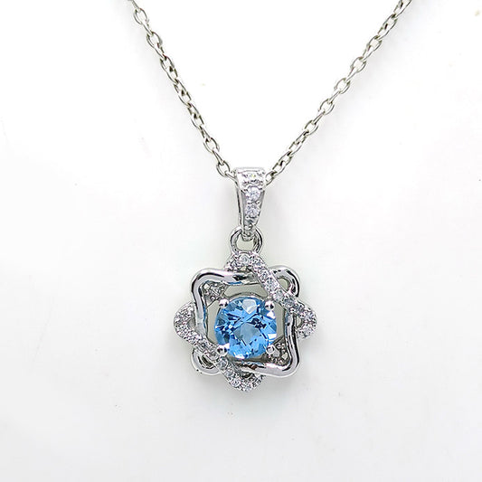 Blue Topaz Rosette Halo Earrings